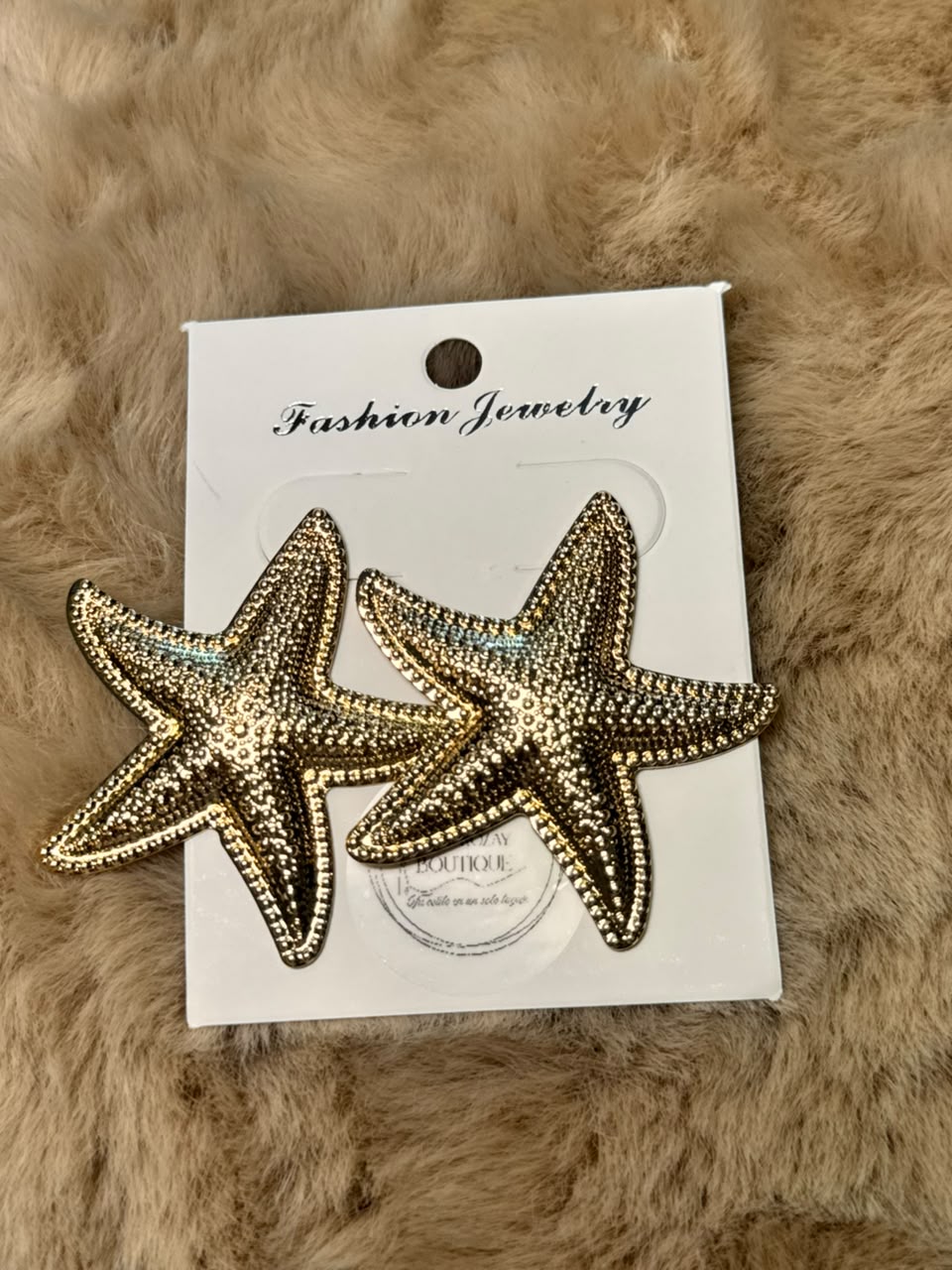 Aretes de forma estrella de mar en dorado